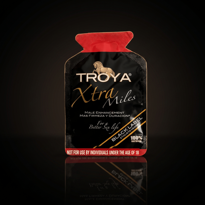 Troya XTRA MILE single-use sachet on a dark studio background