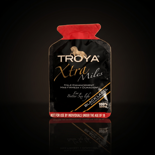 Troya XTRA MILE single-use sachet on a dark studio background